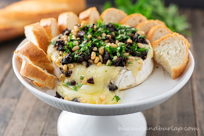 baked brie on stand with crostini