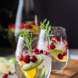 white sangria in glasses with cranberries