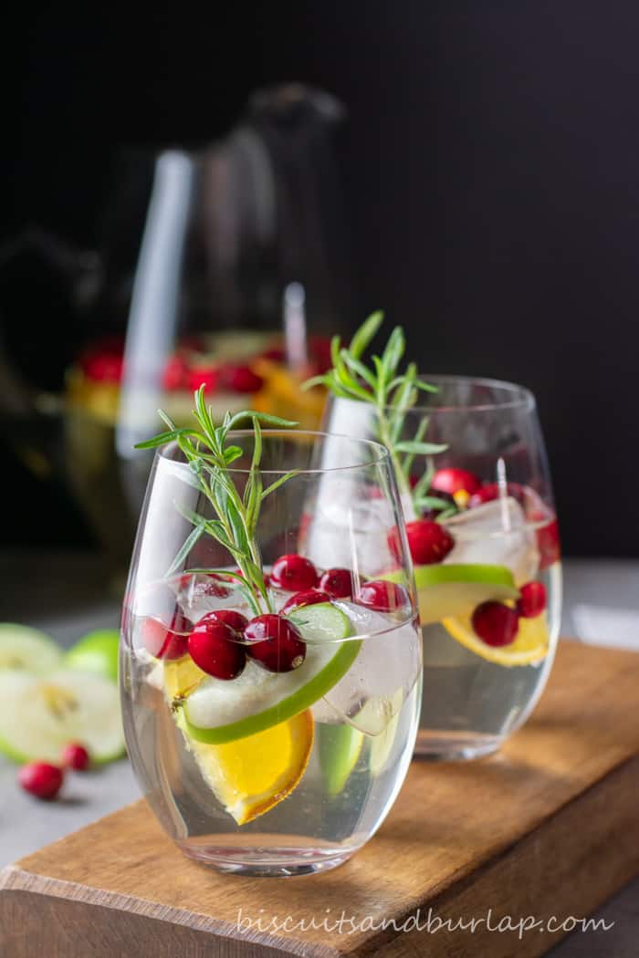 white sangria in glasses with cranberries