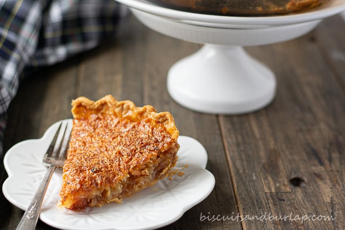 slice of pie on plate with stand behind