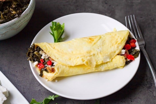 collard green and red pepper omelet on plate