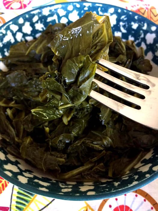 close up of collard greens with fork