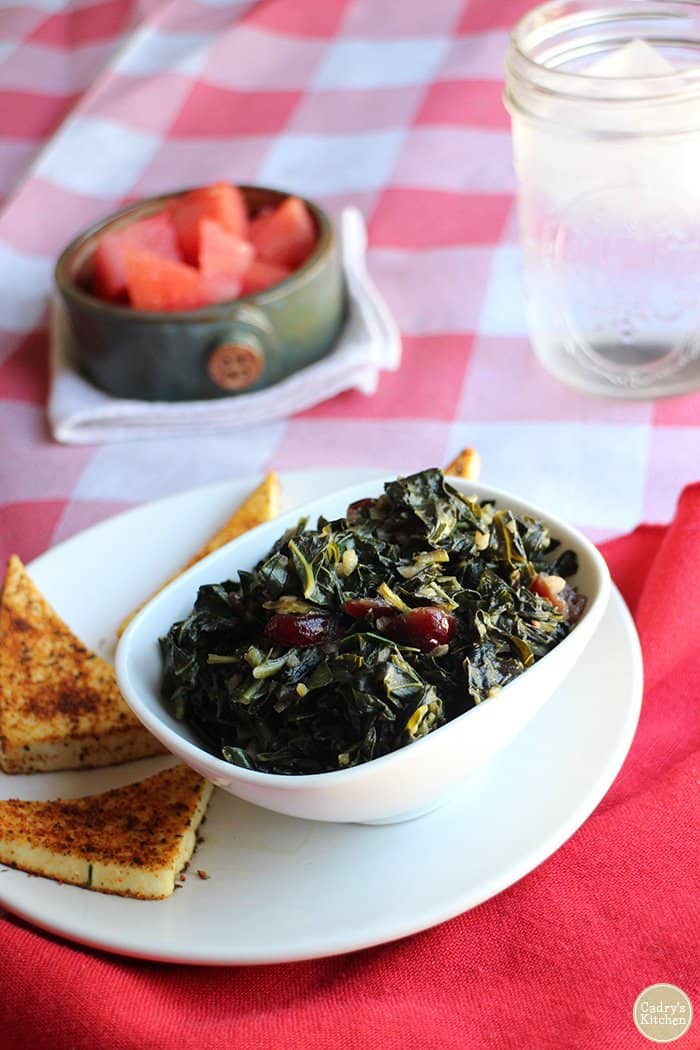 smoky sweet collard greens in white bowl