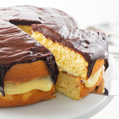 slice being removed from boston cream pie.