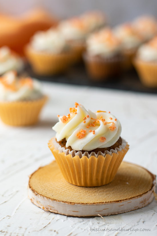 carrot cupcake on coaster with more in back