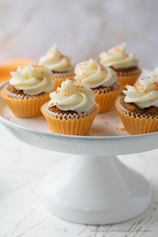 several carrot cake cupcakes on stand