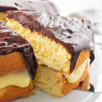 slice being removed from boston cream pie.