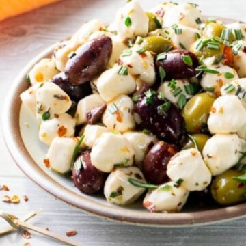 bowl of mozzarella pearls and olives