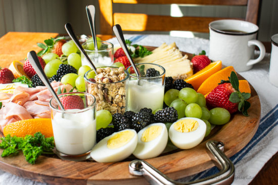 breakfast platter with spoons in yogurt