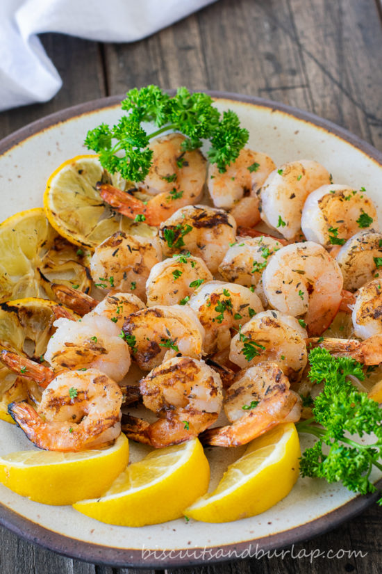 grilled shrimp on plate with lemons & parsley