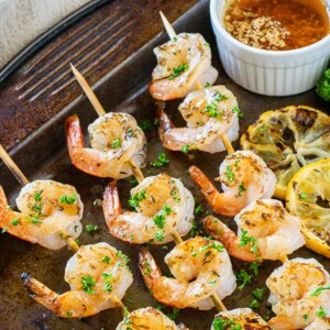 grilled shrimp skewers on pan.