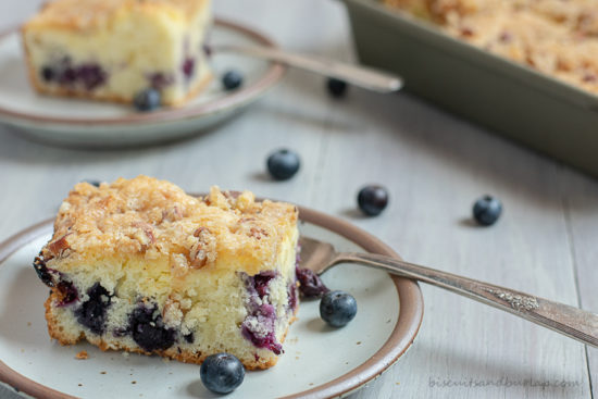 one slice of cake on plate with another behind