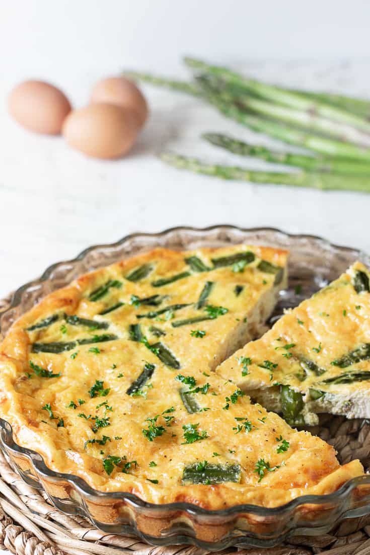 easy chicken quiche with eggs and asparagus in background