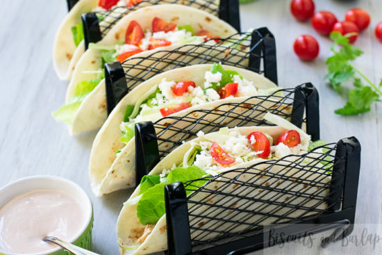 horizontal shot of fish tacos in stand