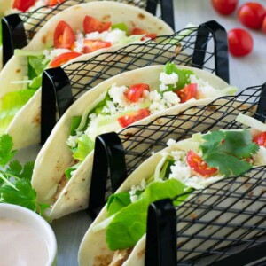 tacos with sauce and tomatoes