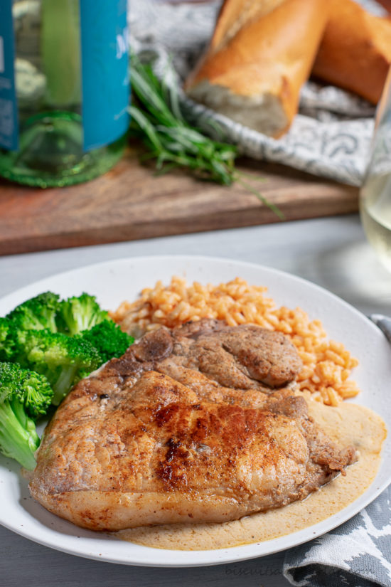 pork chop on plate with broccoli & rice