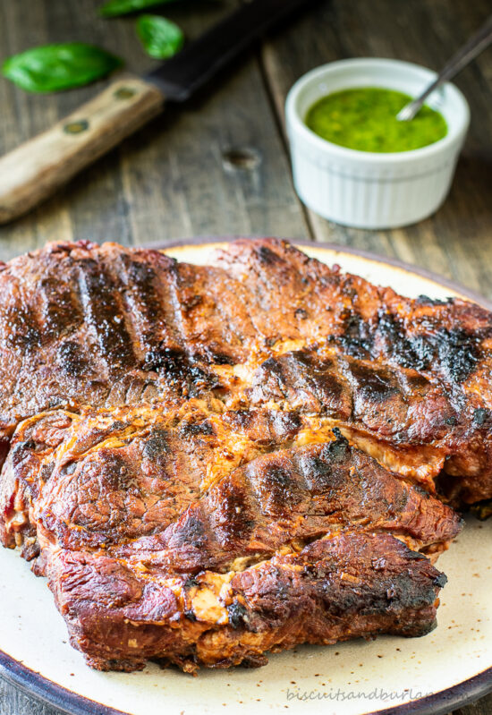 beef on plate with sauce behind