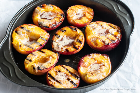 grilled peach halves on pan