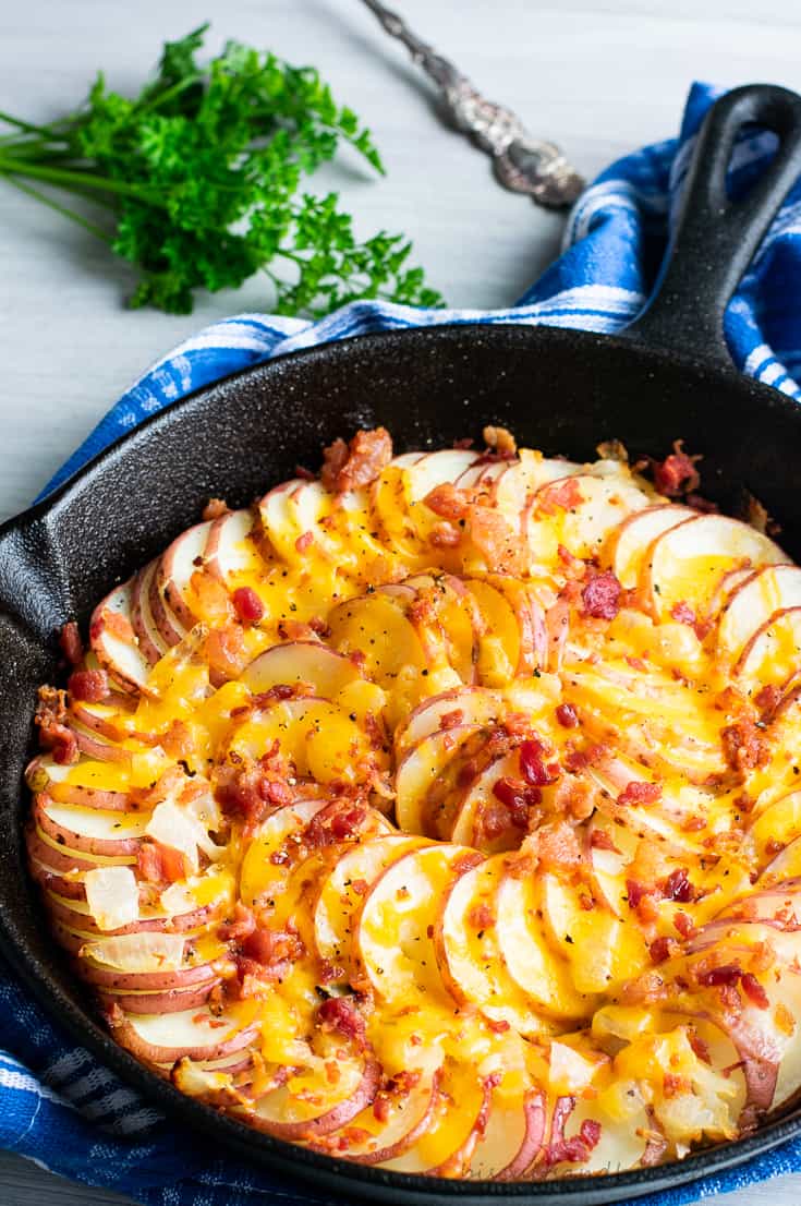 skillet potatoes with cheese and bacon on top