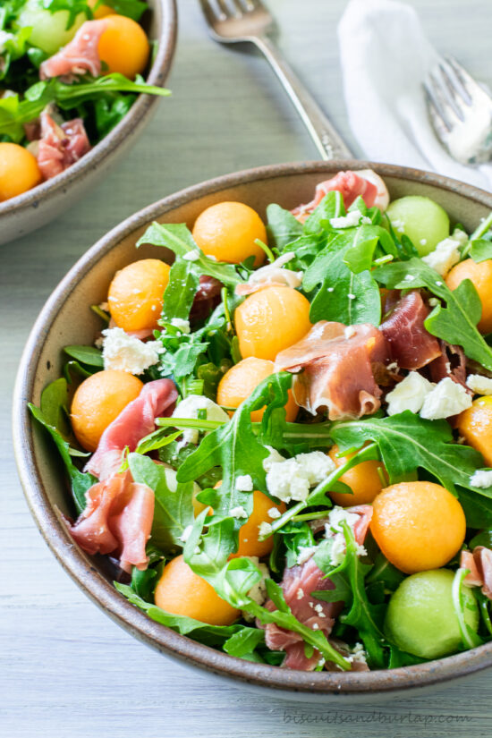 melon salad in bowl with another behind