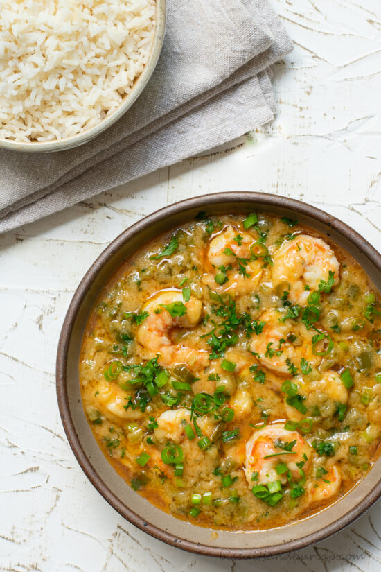 bowl of shrimp etouffee with bowl of rice