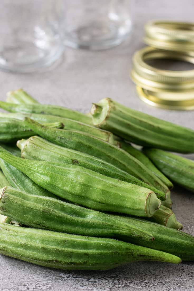 okra with jars and lids behimd