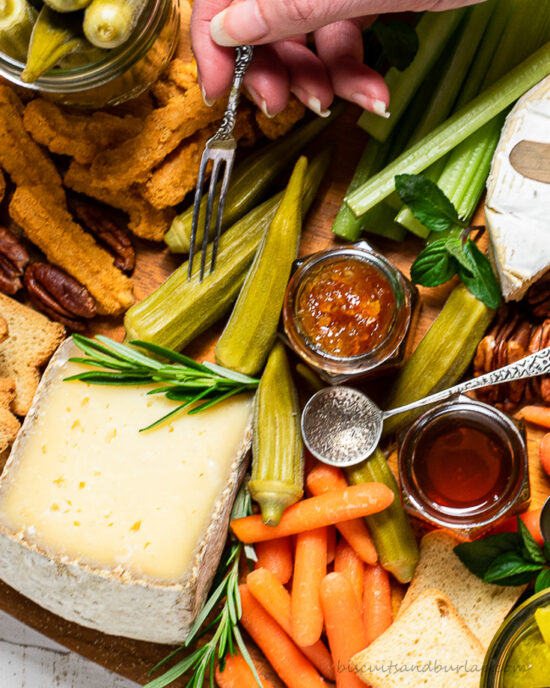 close up of cheese board with pickled okra
