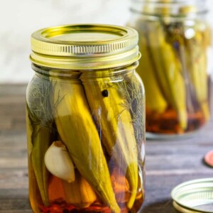 jar of pickled okra with another jar behind