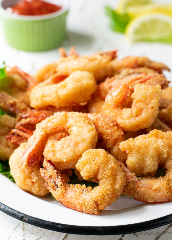 fried shrimp on plate with cocktail sauce