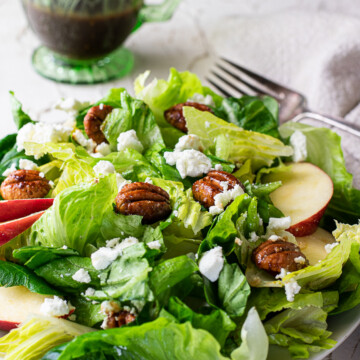 fall salad with apple cider vinaigrette behind.