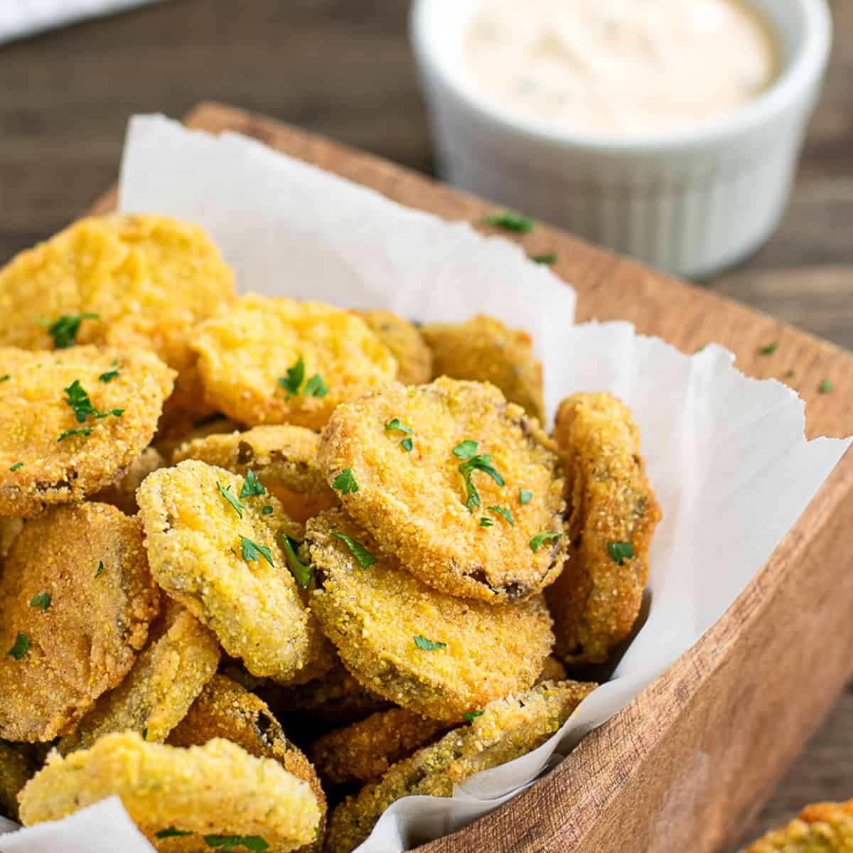 fried pickles with dip behind.