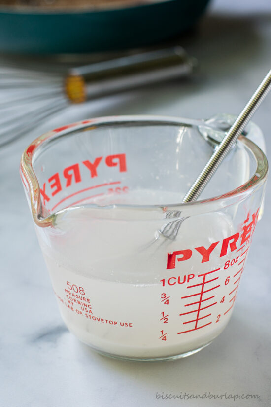 flour & water in measuring cup for making homemade gravy from scratch