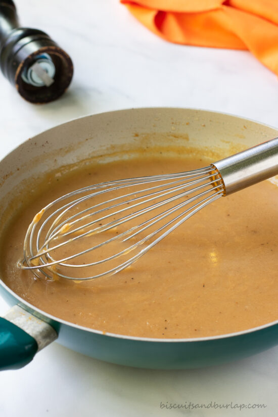 made from scratch gravy in skillet with whisk