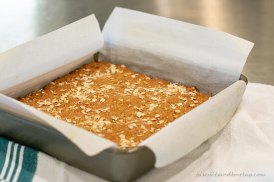 breakfast bars in pan with parchment