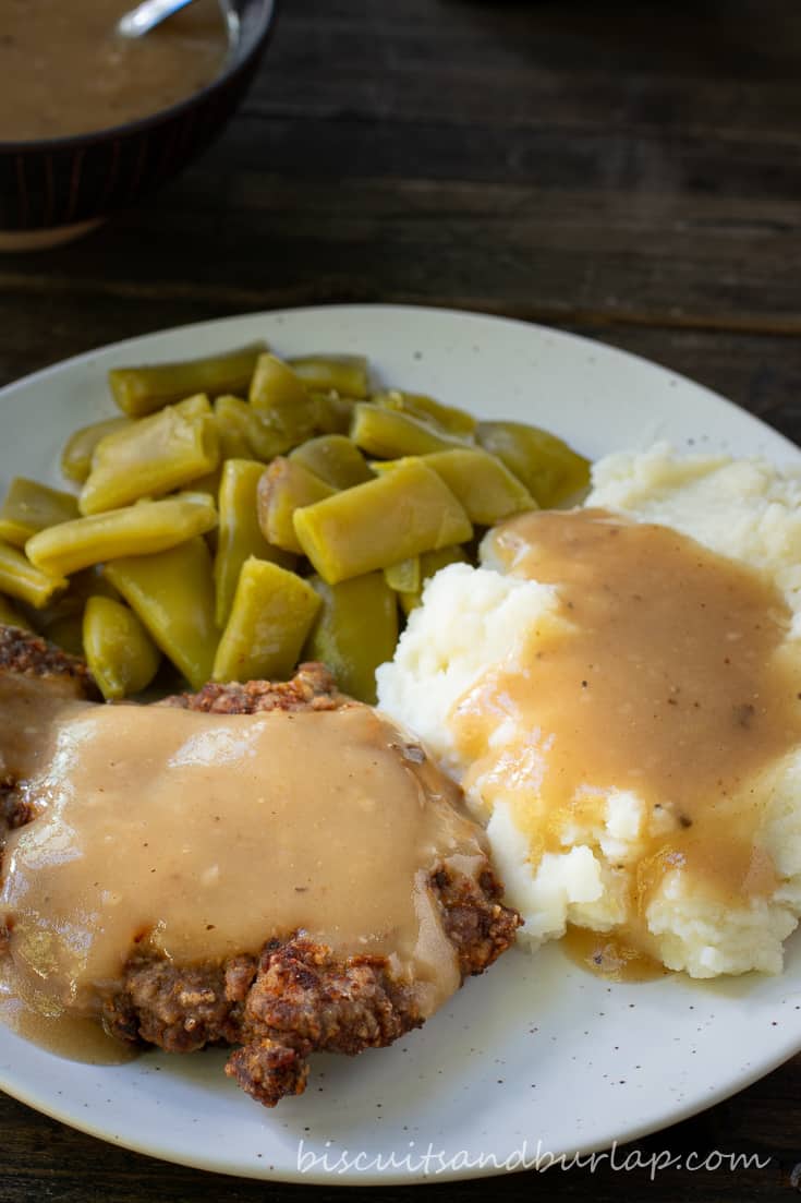 country fried steak, potatoes and beans
