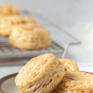 biscuits on small plate with more behind