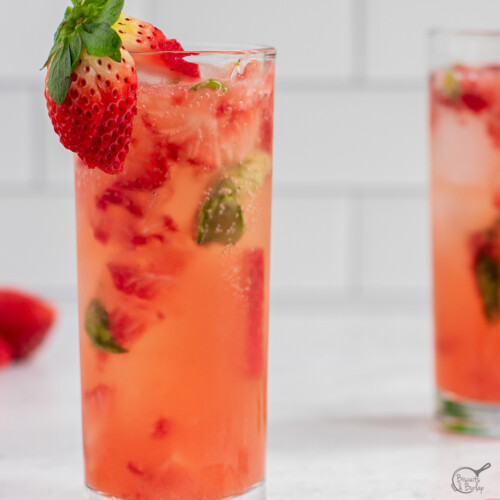 cocktail with strawberry basil and gin in glass.