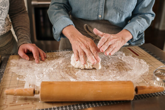 biscuit dough being patted out