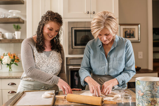 women cutting biscuits