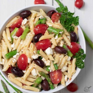 pasta salad with tomatoes and asparagus.