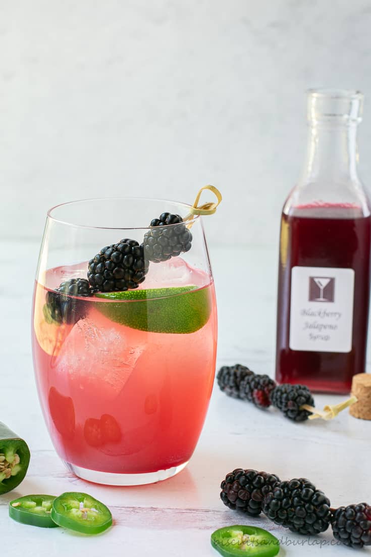 blackberry margarita with syrup bottle