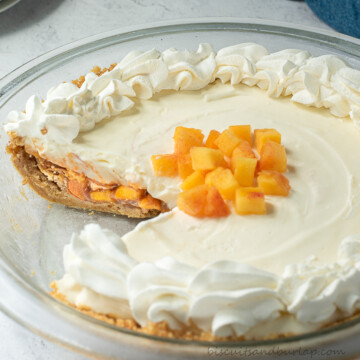 peach mango pie with slice out.