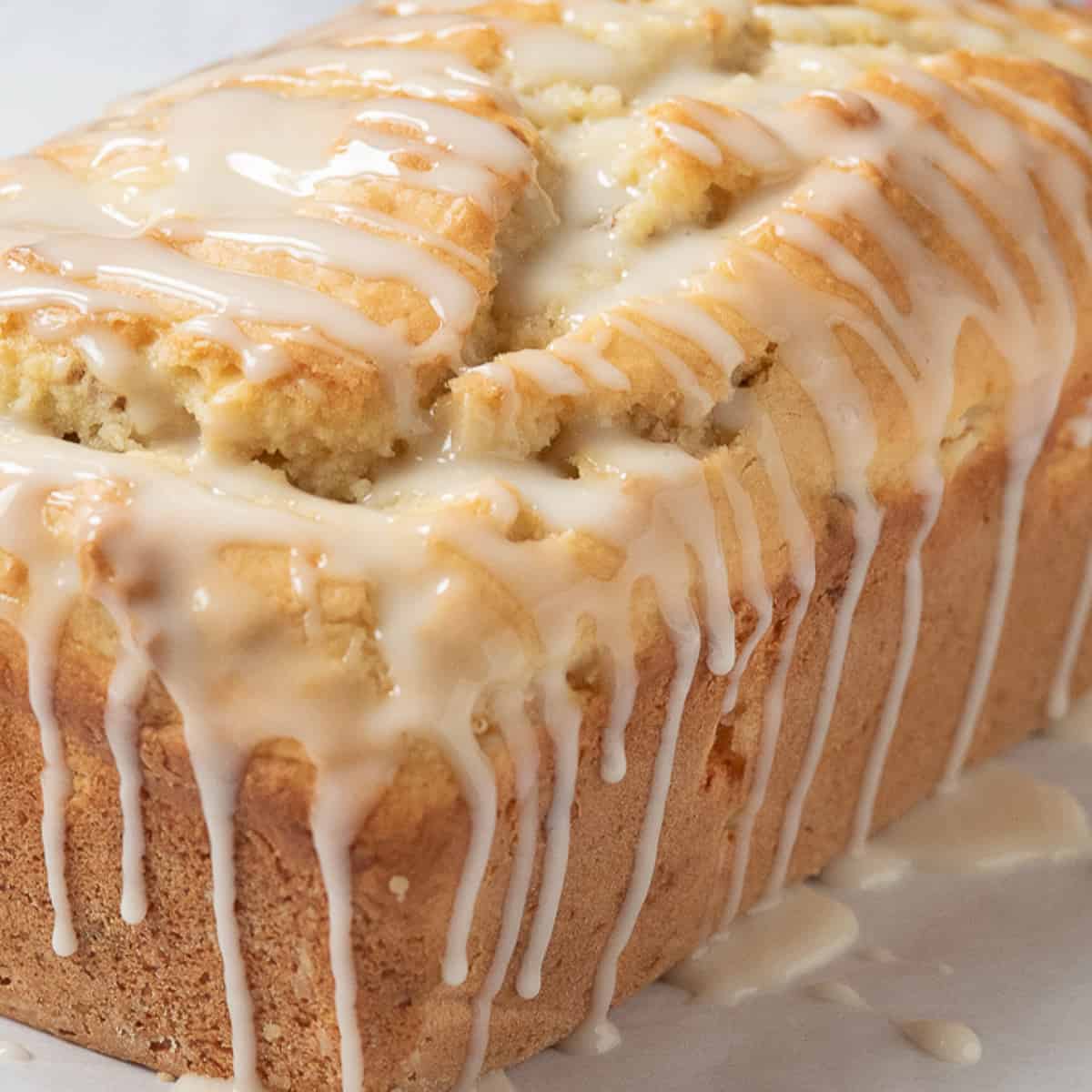 loaf of fresh peach bread with glaze.