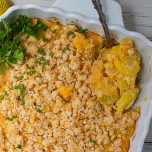 one end of keto squash casserole with spoon.