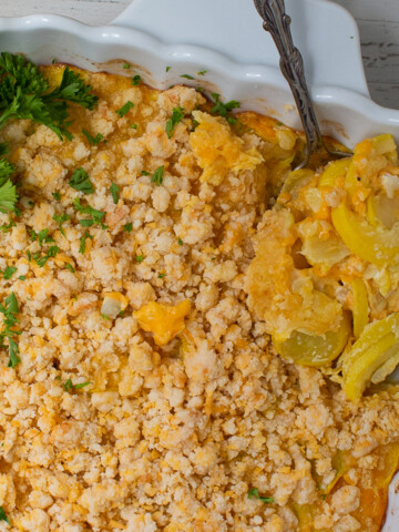 one end of keto squash casserole with spoon.