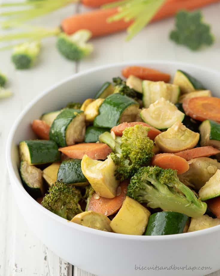 smoked vegetables in bowl with more behind