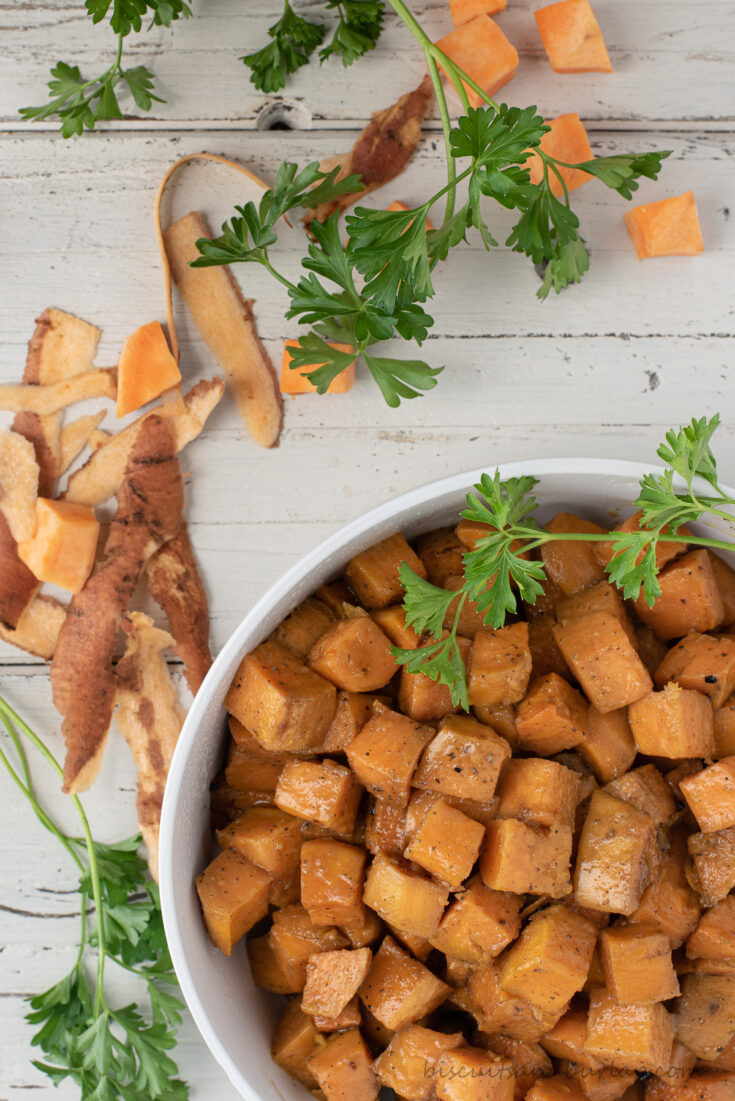 bowl of sweet potatoes in corner with peelings