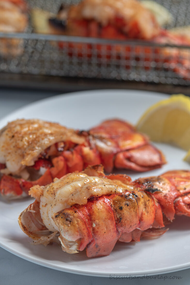 two air fryer lobster tails on plate