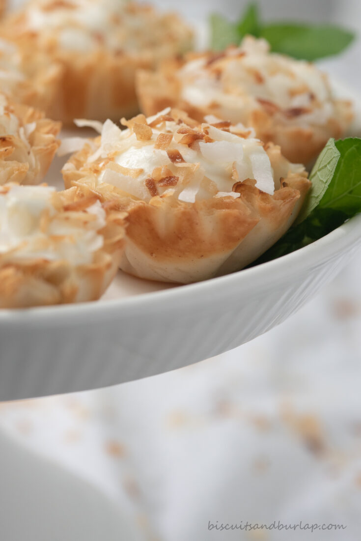 coconut tartlets on white stand