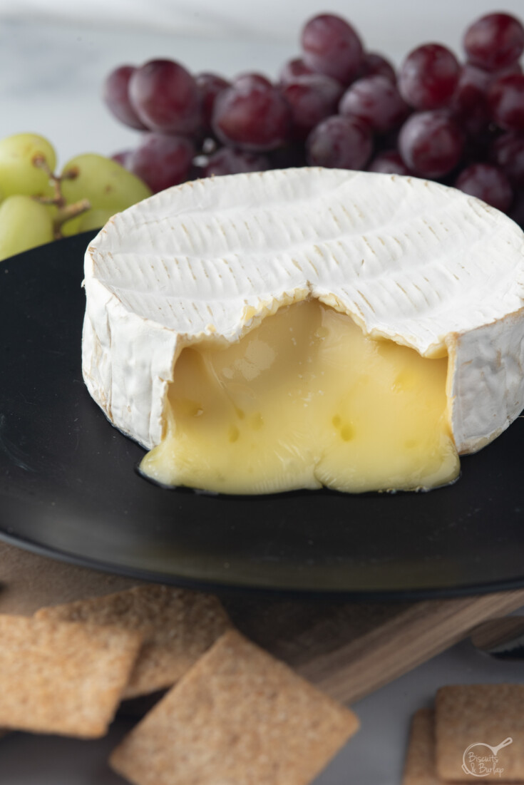 brie vs. camembert with brie on plate